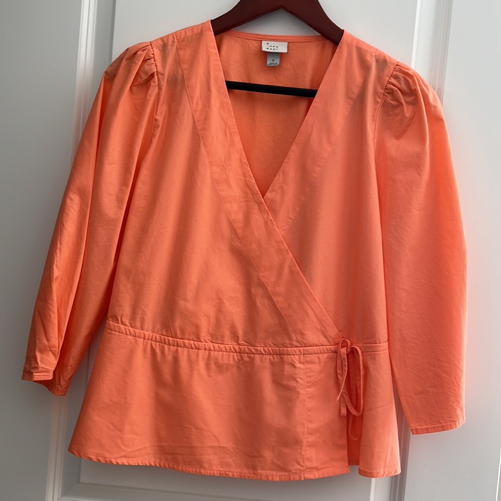 100% cotton orange top.